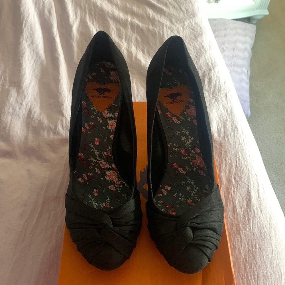 Like new black silk like pumps. Only worn once.